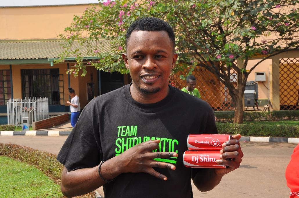DJ Shiru poses with his personalized branded Coca-Cola cans bearing his ...