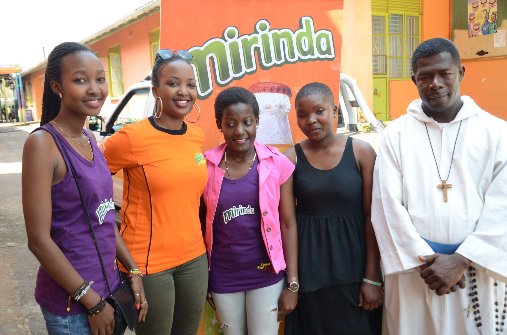 Crown Beverages Limited's brand executive- Tracy Kakuru takes a photo with reigning Mirinda Miss Teen Vaneesa Nansoove (in pink) and the first runner up Budesian Kyagera. 