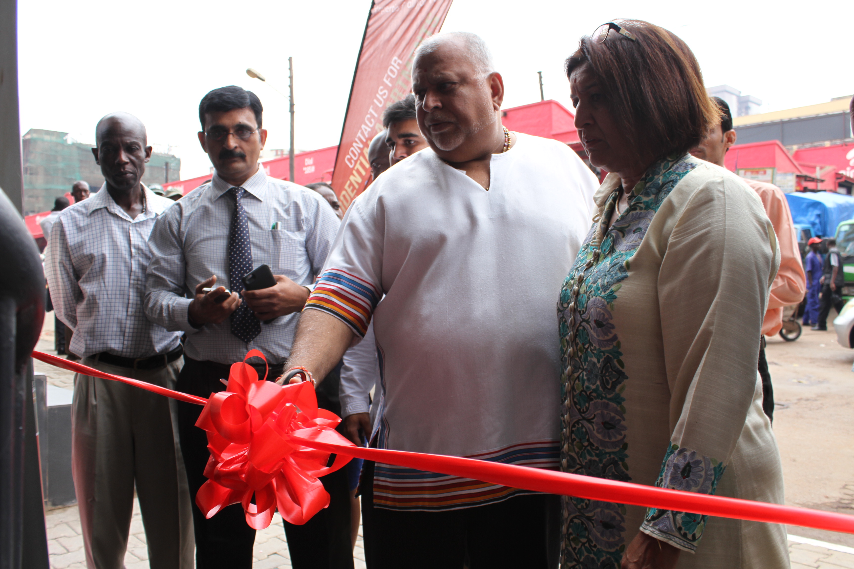 Sudhir Ruparelia cutting the tape to officially open Hardware City building 