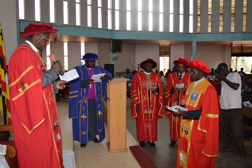 Dr. Stephen Mung'oma being installed by the Chancellor of Uganda Christian University and archbishop of the Anglican Church of Uganda, Stanley Ntagali. 