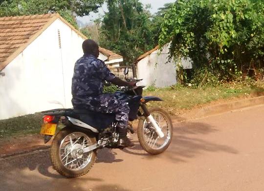 A police officer rides on the streets of Makerere