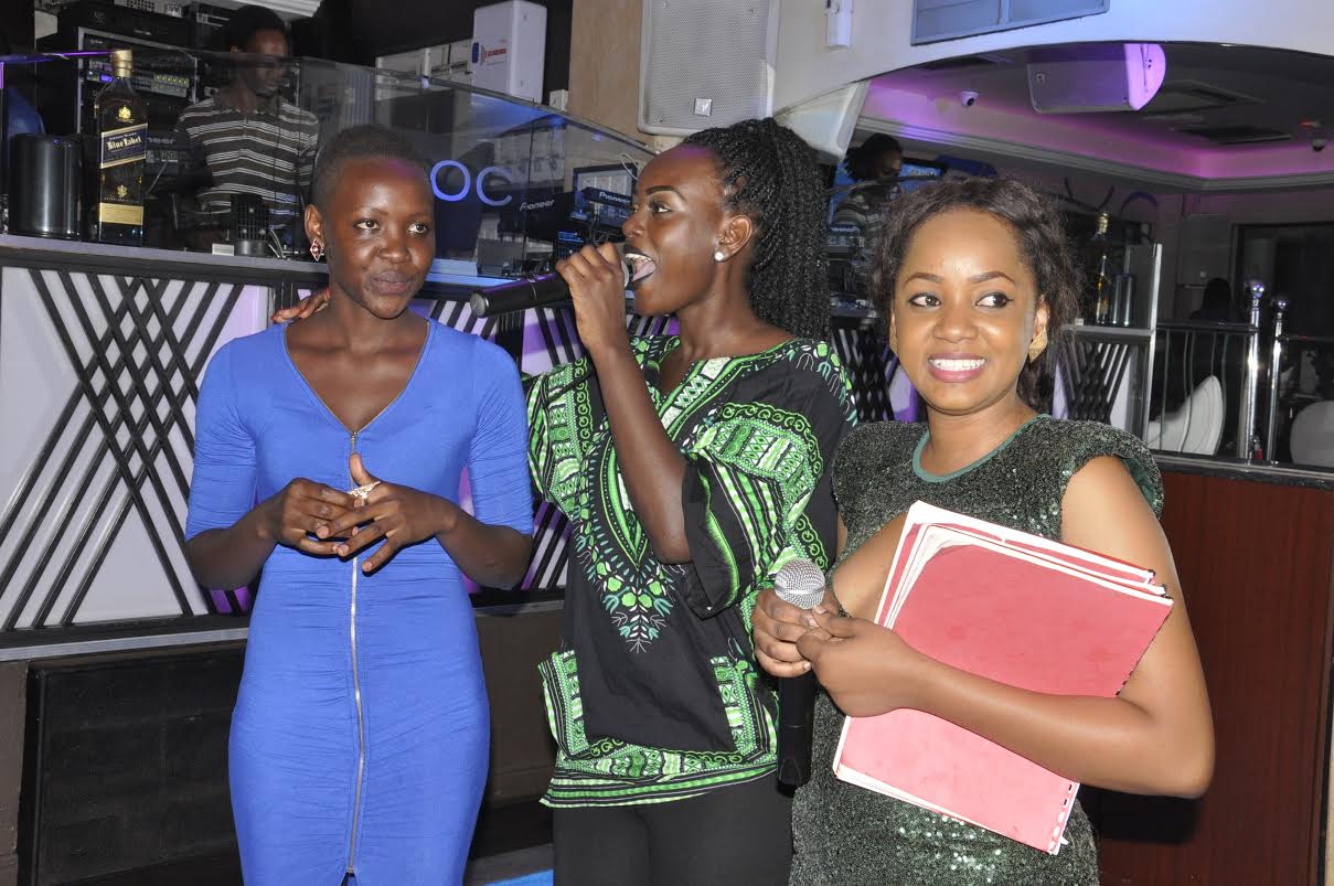 Bettinah Tiana (C) and Toto (extreme right); presenters on NTV and Spark TV respectively were the night's emcees.