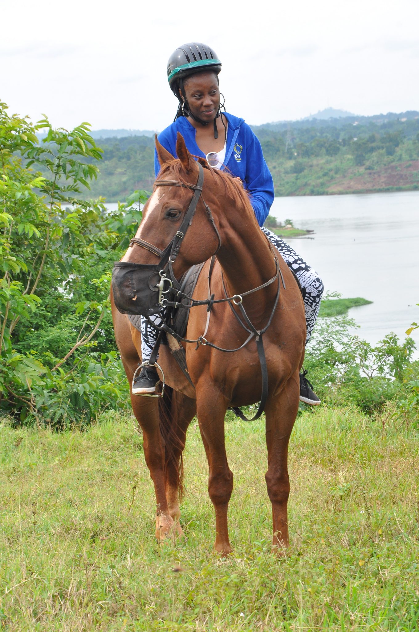 Becky Nantale of Power FM horse riding at the launch of Cocacola's Taste...