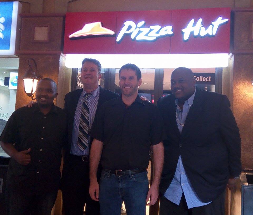 (From L-R) Bryan McKenzie, CEO Pizza Hut Randall BlackFord, Ted Pantone and Tom 'The Mith' Mayanja