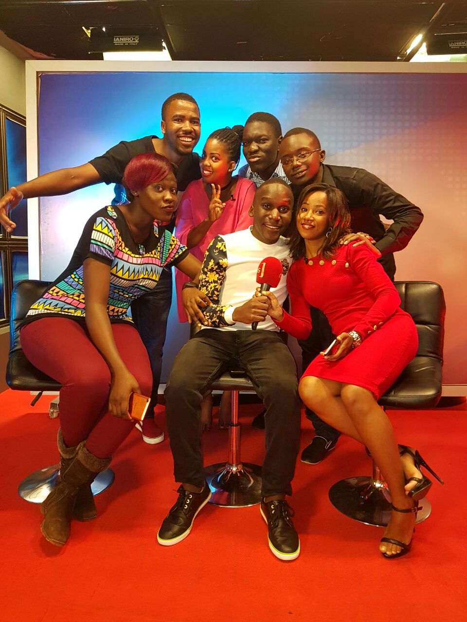Tamale Aaron centre (seated) with colleagues in studio.