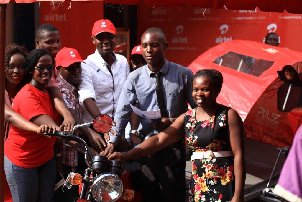 The Airtel Uganda Team led by Territory Business Manager Nathan Balinda(Centre) hand over a bike ambulance to Bulambuli health centre officlas.