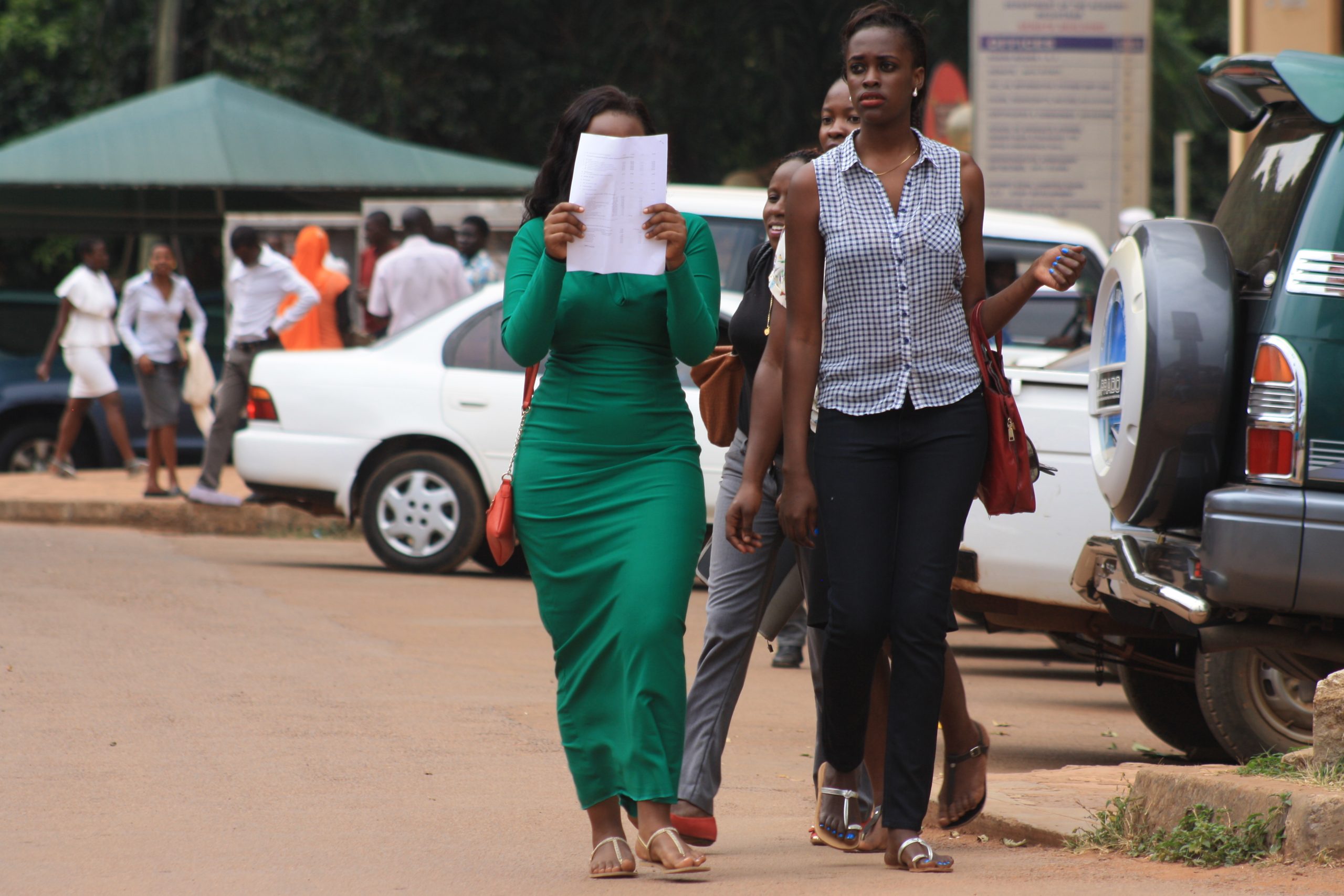 A couple strolls along the campus streets of Makerere| Photo by Zahra Abdul