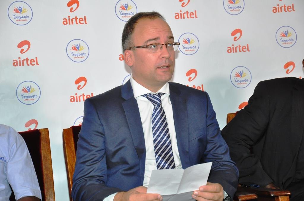 Airtel MD Mr. Tom Gutjahr addresses the media at the launch of the Yooyoota Namugongo raffle at the Kampala Archdiocese Head office in Rubaga