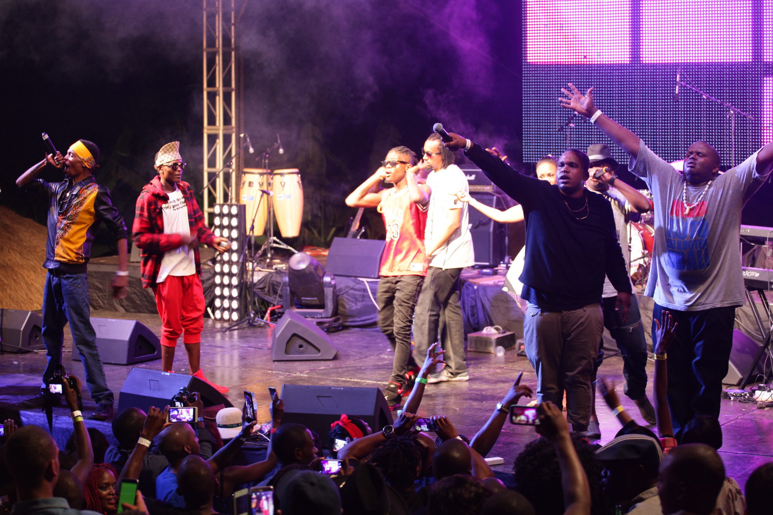 Madtraxx (far right), Majja and Kid Kora (far left) of the musical group- The Kansol are joined on stage  by chameleon, Navio and Weasel during the 11th Edition of Blankets and Wines