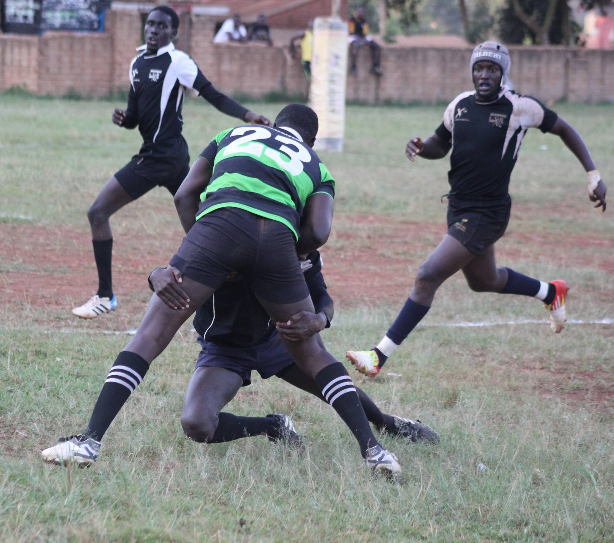 Impis player doing a 'Suarez' on the Rhino Rugby Player's nuts