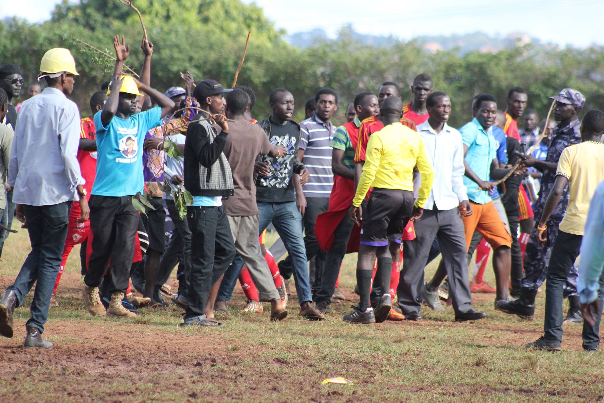 Makerere supporters with sticks attacking Jude Kalemeera.