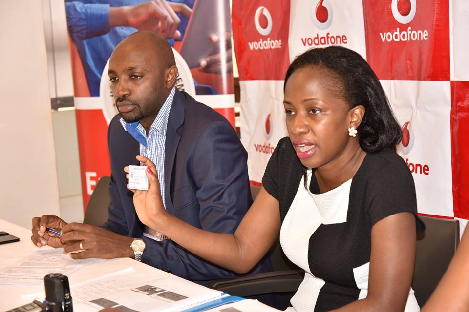 Faith N. Kyateka- Communications and External Relations manager Marie Stopes Uganda shows to the press a copy of the medical card that will be rewarded to winners of the "Hackathon", an app innovation challenge hosted by Vodafone Uganda, Marie Stopes and Hostalite E.A.