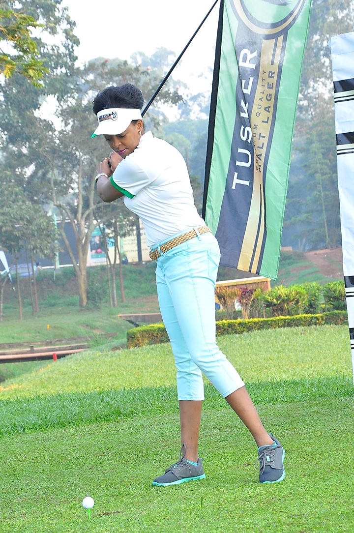 UBL Marketing Director, Ms. Juliana Kaggwa tees off during the opening of the Tusker Malt Uganda Open