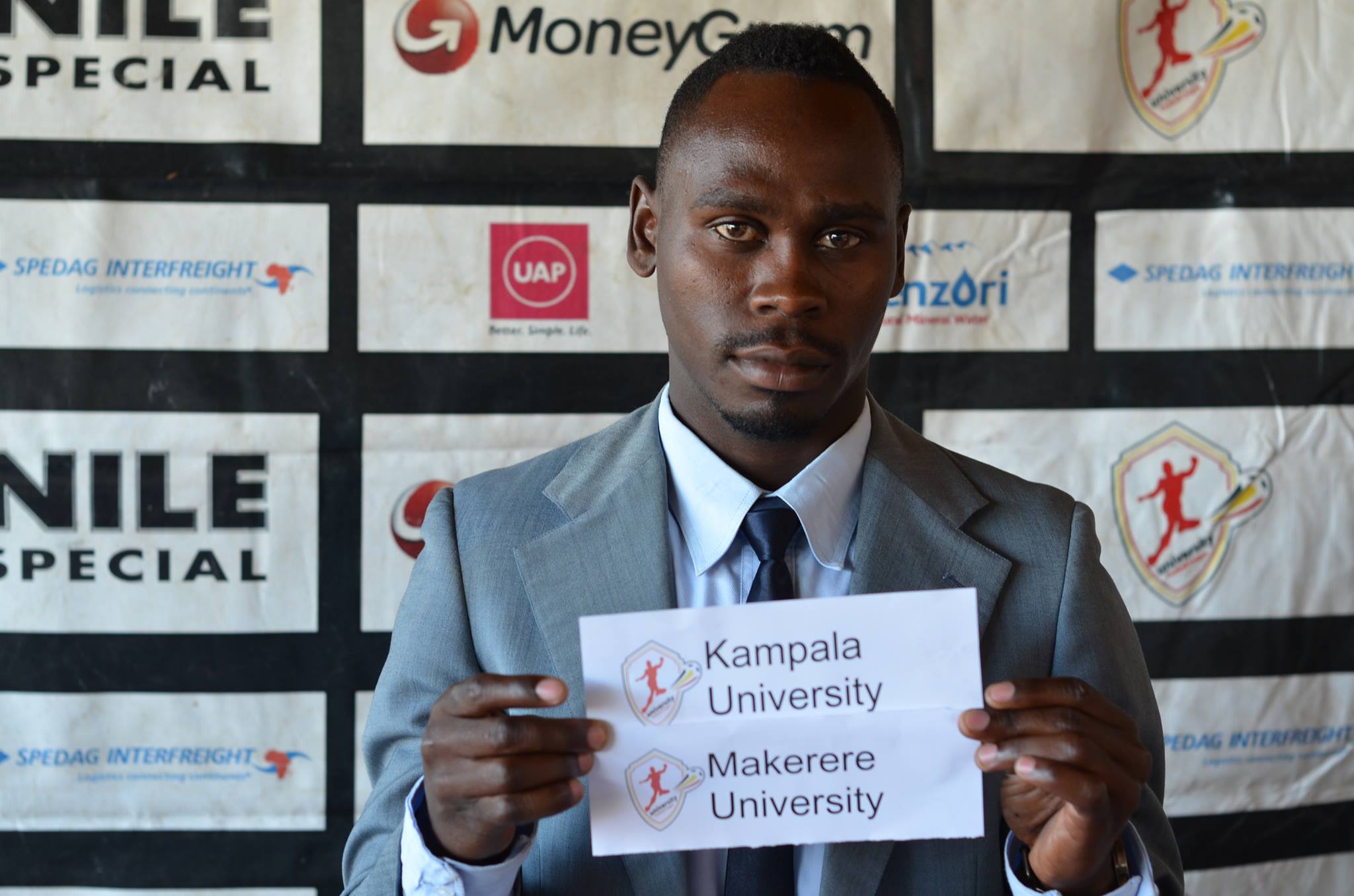 Frank Nduga captain Kampala University displaying his draw card