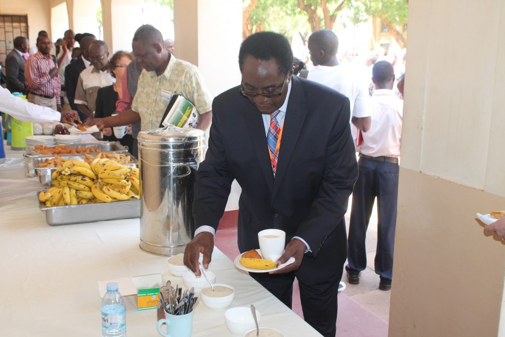 The Vice Chancellor, Prof John Ddumba-Ssentamu, lining up for breakfast, recently. Students say that they need services like these ones.