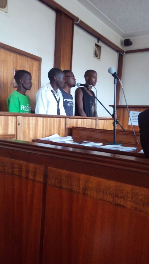 The four before the Buganda Road Magistrate.