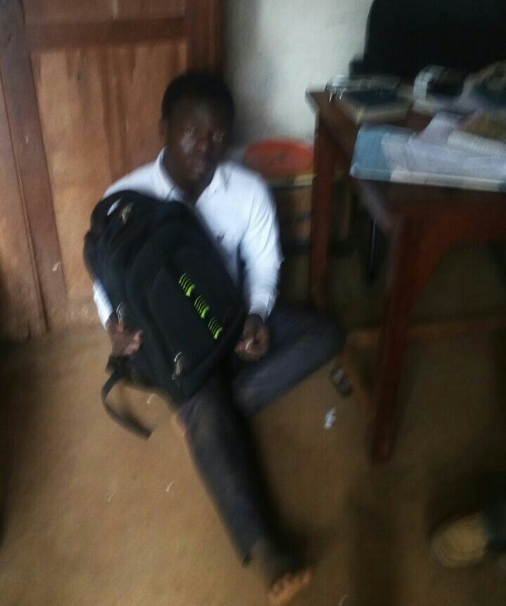 Donald Kawanguzi with the bag he had stolen.