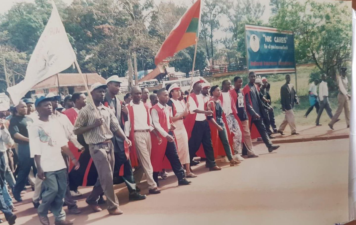 "Marching with the towering tall Kaweesi (in white cap), Makerere University 1997," Sarah Kagingo.