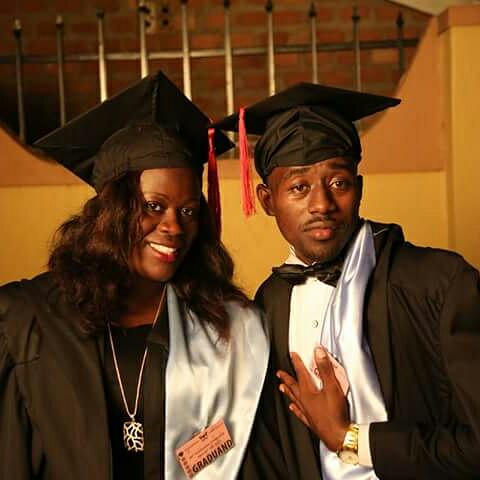 Bamwine (L) with a friend on graduation day at Makerere two weeks ago.